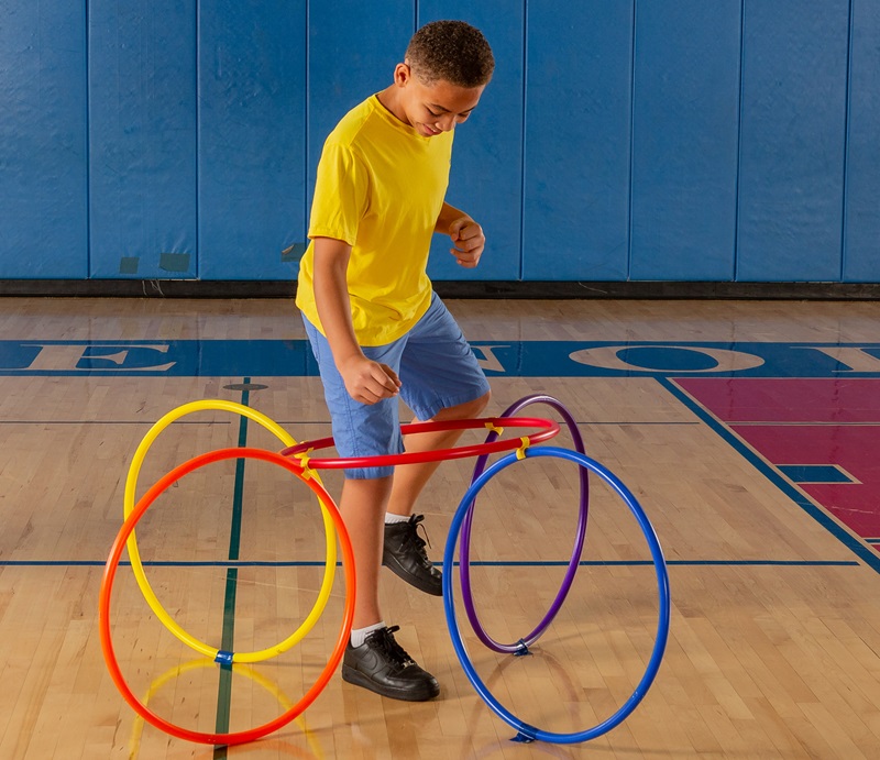 Students using hoops in gym activity